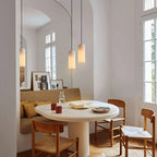 Alabaster Cylinder Pendant – natural stone, brass accents, hardwired