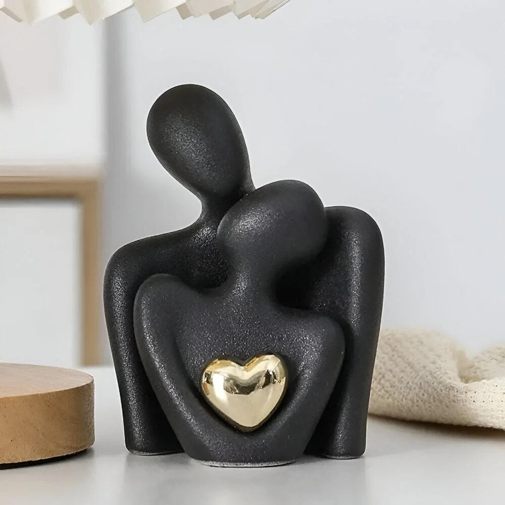 Ceramic Couple Sculpture – abstract embracing form, polished heart detail