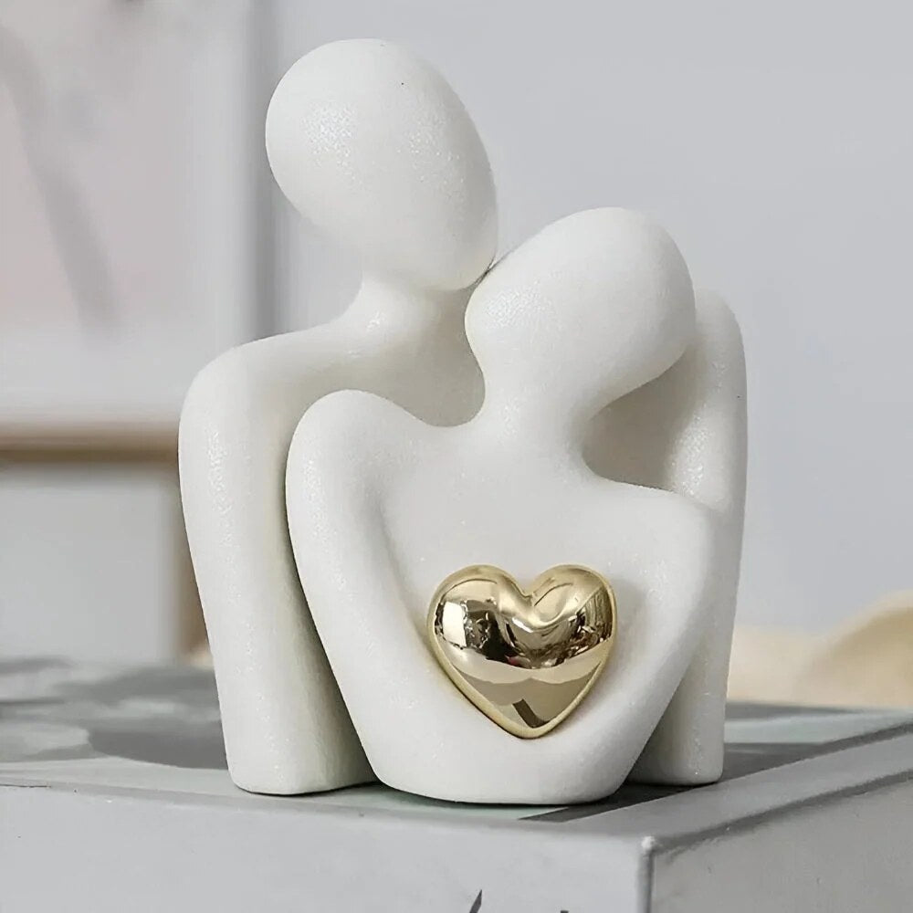 Ceramic Couple Sculpture – abstract embracing form, polished heart detail