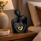 Ceramic Couple Sculpture – abstract embracing form, polished heart detail