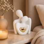 Ceramic Couple Sculpture – abstract embracing form, polished heart detail